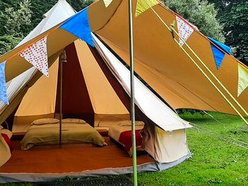 Bell tent with awning and bunting