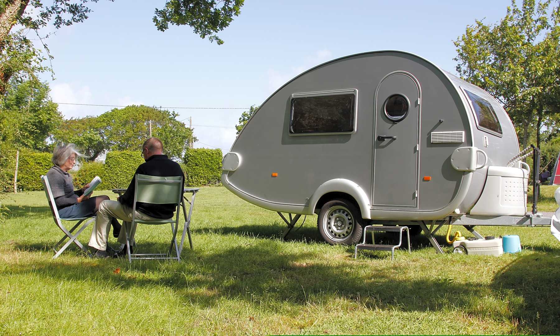 A teardrop trailer on a campsite in France