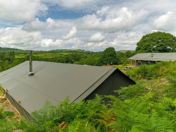 The view over the top of the tents to the valley beyond
