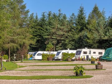 Fully-serviced gravel and hardstanding touring pitch