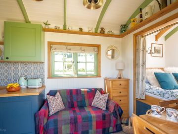 A cosy sofa for two and a sturdy oak table for dinner nights.