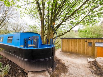 Outside the cabins we have a dry dock canal boat