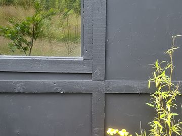 Exterior of shepherd's hut from decked area