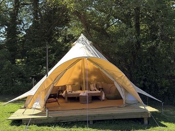 External view of bell tent on decking pad