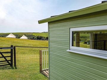 View from barn owl cabin garden showing the bell tents.