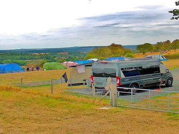 Lwb campervan on all weather hardstanding with roll out awning