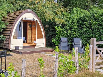 Hobbits lodge camping pod with its own private fenced in front garden
