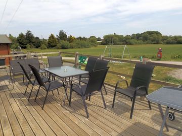 Decking area with open view and garden furniture, ideal for alfesco dining