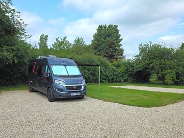Hhardstanding pitches with grass space for an awning