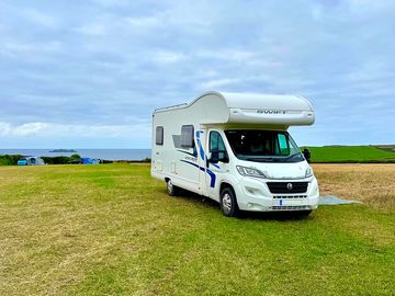 A motorhome pitched on the lower field, short walk to the sea!
