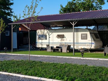 Caravan for rent with seating area at camping palić.