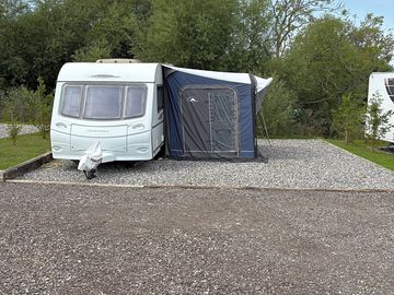 A caravan with awning attached