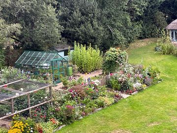 Our gypsy van and shepherd's hut are sited in a large family garden