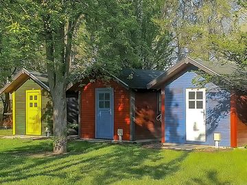 Brightly painted cabin exteriors