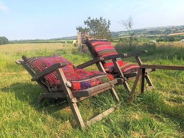 A couple of our chairs sat in the field.