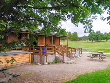 Clubhouse with picnic benches outside