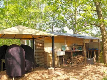 Woodmans cabin outdoor lean-to kitchen