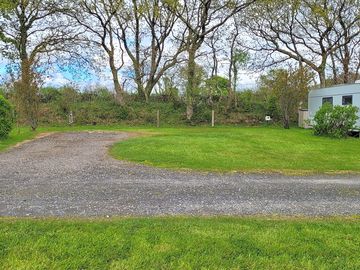 Badger's den pitch, part hardstanding and part grass