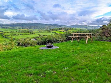 Private campsite pitch complete with picnic table, firepit and water/electricity included