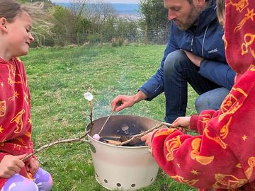 Wild campers cooking some marshmallows