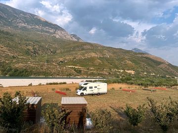 Spacious pitches by the river beach