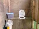 Compost toilet. coverband on seat.