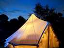 Bell tent at night lovely lights and fairy lights inside