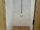 Unisex spacious hot showers.