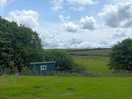 View of the sheep field and the shepherd hut