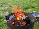 Enjoying the fire, with onsite bags of wood