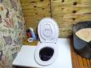 Compost loo - check out the wallpaper!