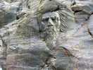 Face in the rock on the beach