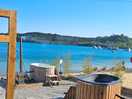 Wood fired hot tubs next to the lake