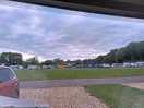 View from our caravan to the back of the site with many tents