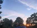 Sunset below the trees.