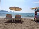 Parasols and loungers are available to hire.