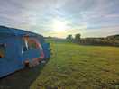 The tenting field with sunset view