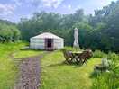 Yurt, in a private wildflower field. hot tub just behind for privacy.