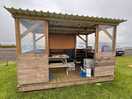 But with picnic table, surface for your cooker and bins,
