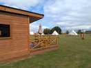Bell tent and mini chalets.