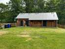 Borders well maintained facilities. upstairs for tented site. down stairs for motor homes
