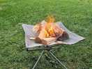 You can light a small fire as long as it is off the ground.