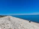 The beach 1 min walk from site to the west