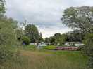 Campsite from footpath on other side of the river
