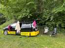 Campervan by a hedge