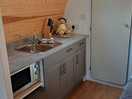 Nice kitchen area, microwave,fridge with v small freezer. cups, glasses, wine glasses provided