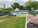 One of the two pools and restaurant seating area.