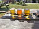 Flight of ciders from the taproom in the beer garden on site