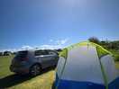Our pitched up tent in the sun!