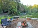 The view of our campfire and two of the hanging tent options in the background.